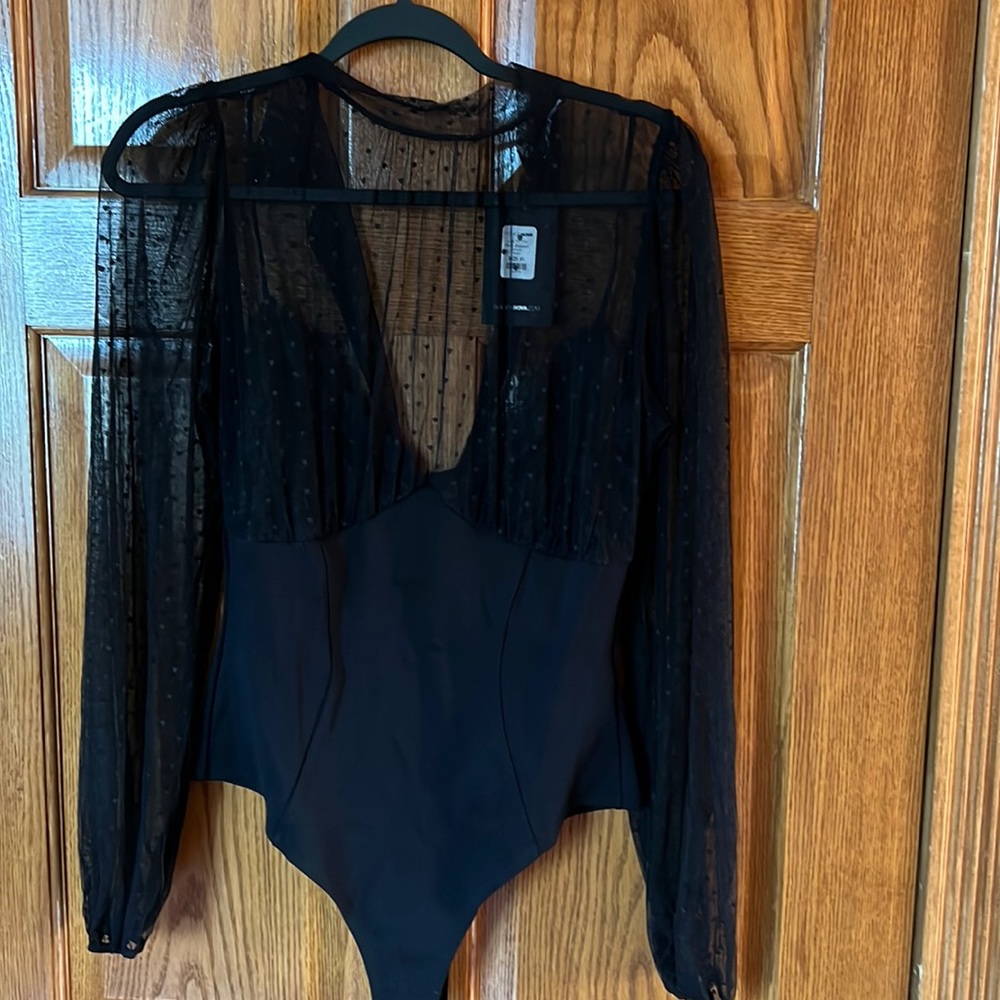 Black Fashion Nova body suite.